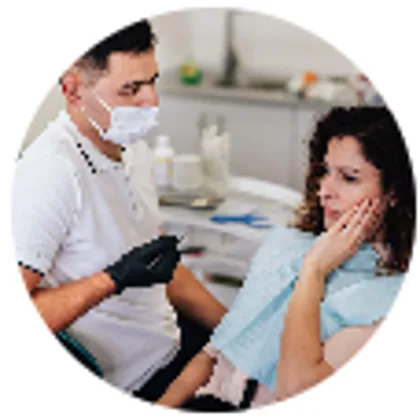 Dentist talking with a patient about their care